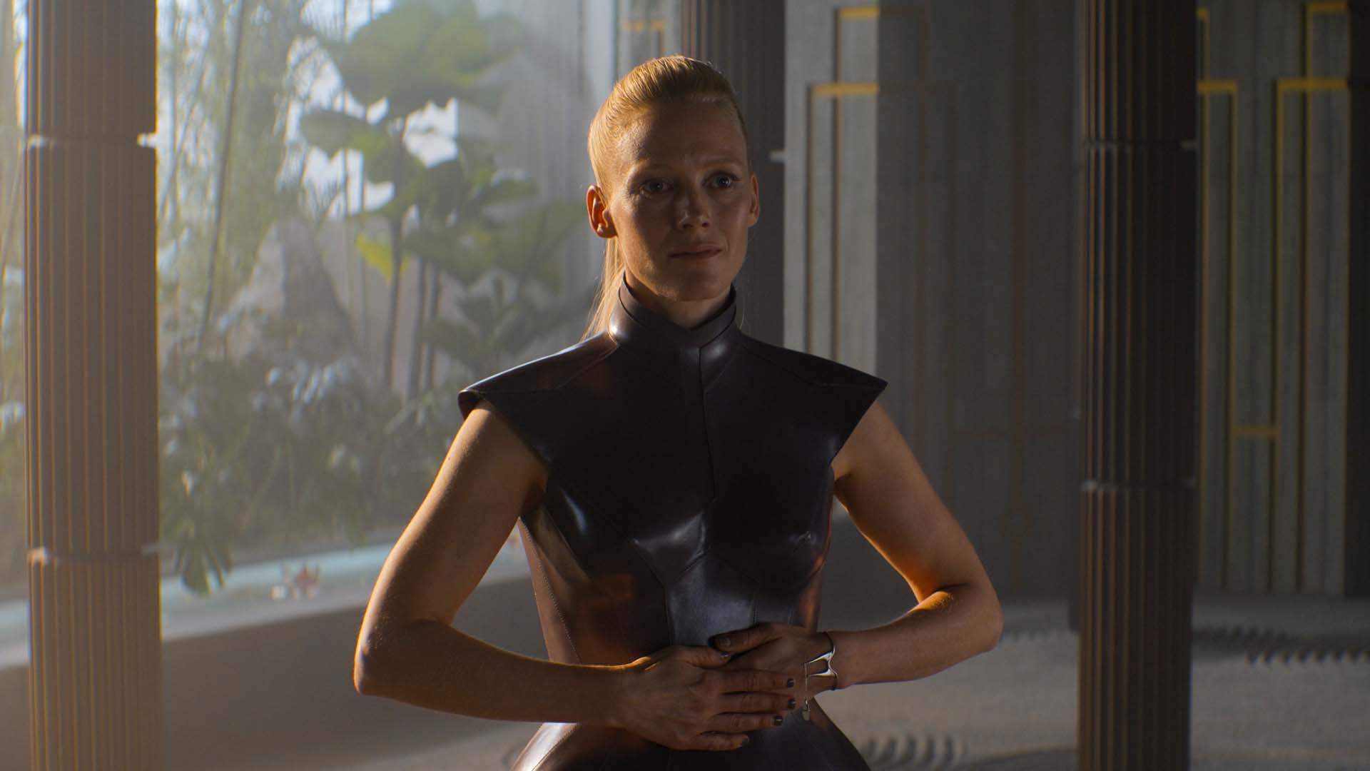 Eto Demerzel stands in a grand room with her hands clasped in Foundation season 2