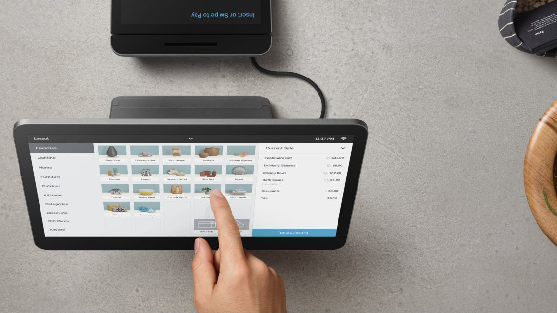 Square POS black hardware terminal in use