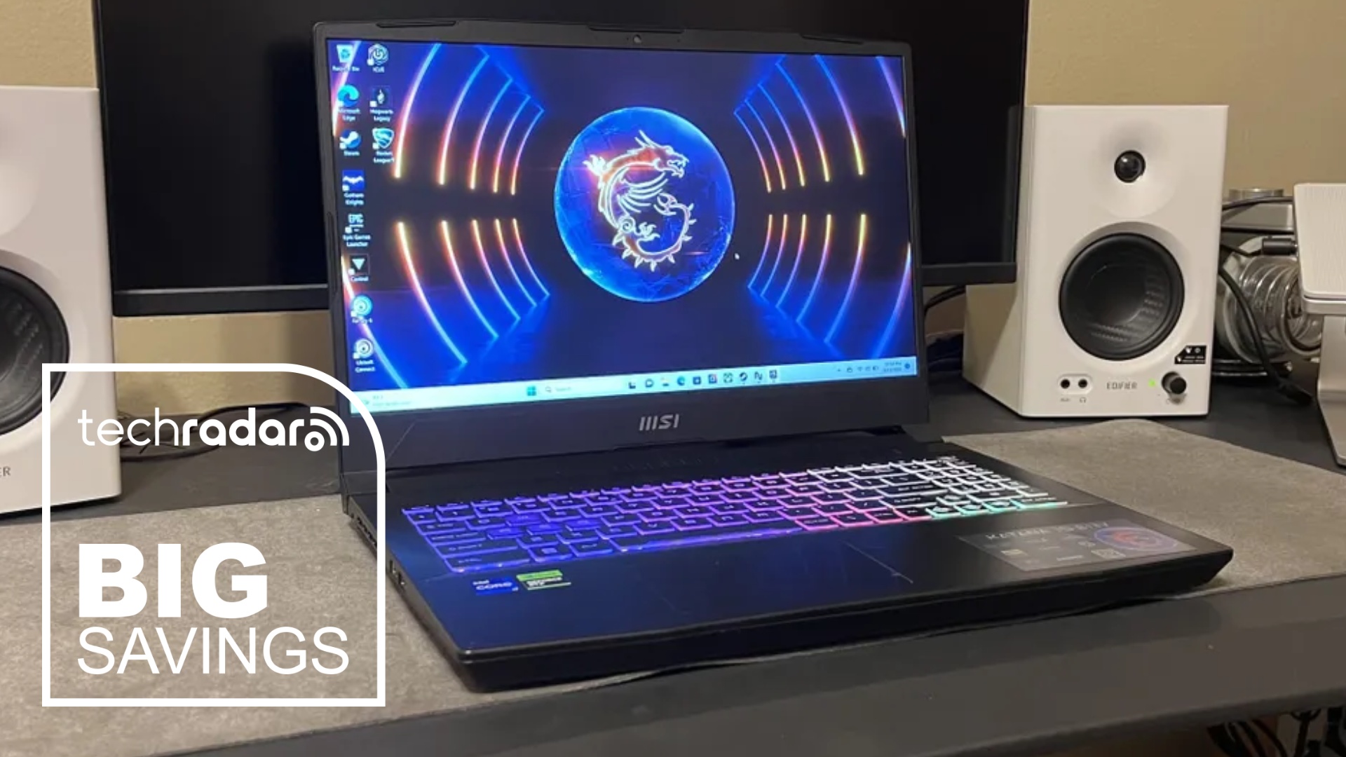 The MSI Katana 15 HX on a desk next to a pair of speakers during our tests
