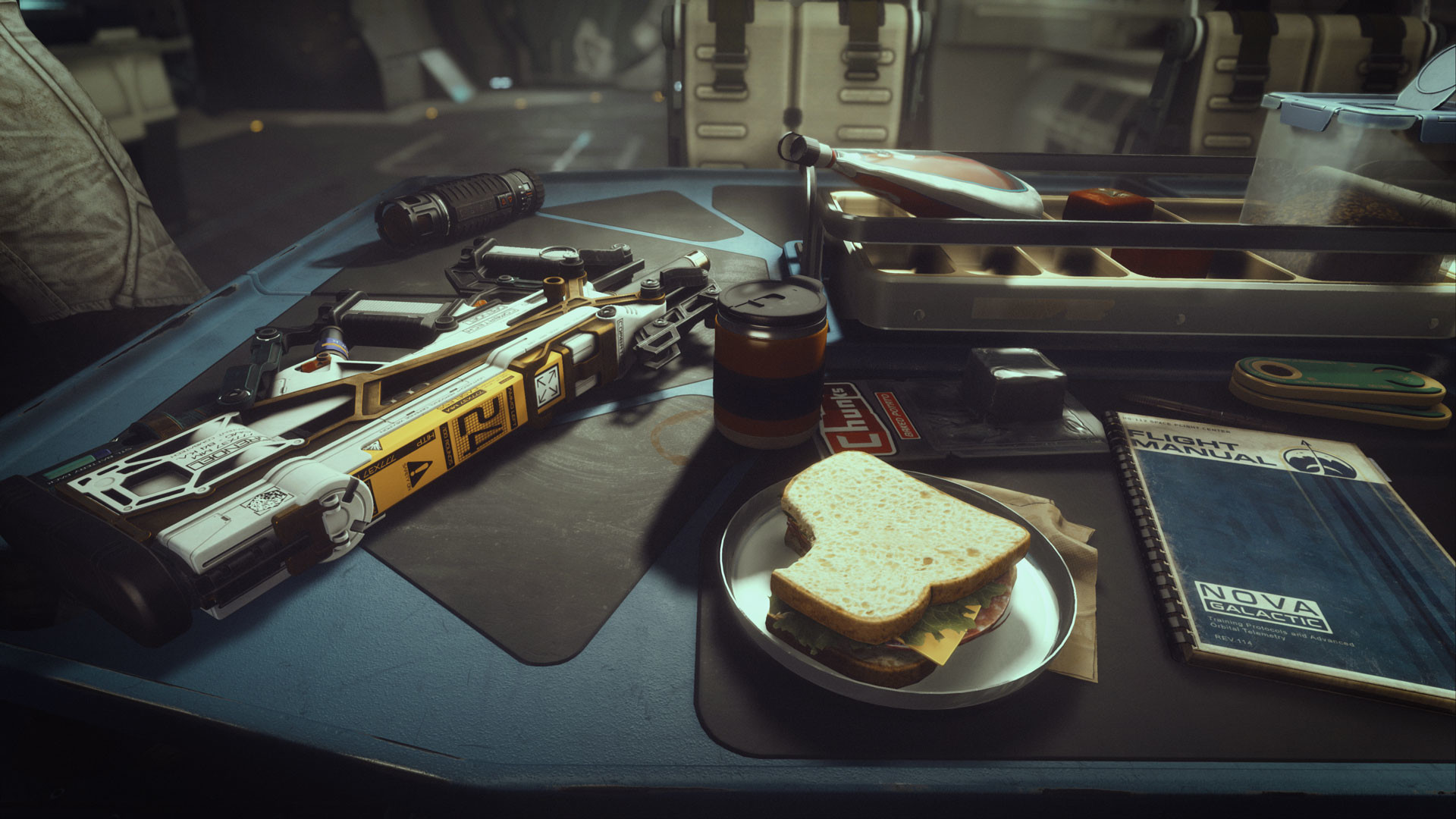 A work desk in Starfield, with a half-eaten sandwich and a weapon laying on it