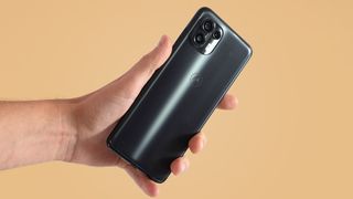 A Motorola Edge 20 Lite from the back in someone's hand