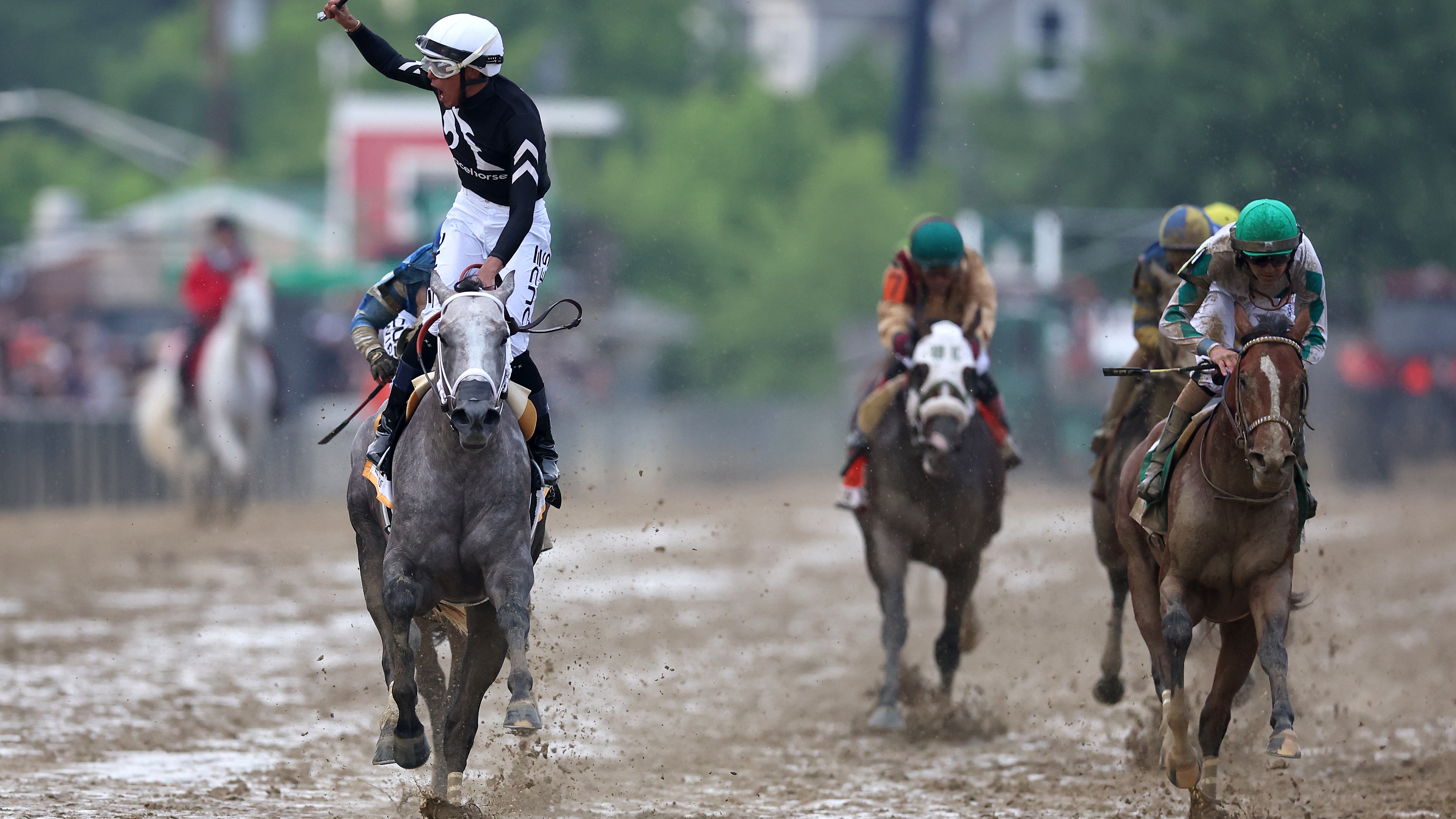 Jockey Jaime Torres celebrates after riding Seize the Grey #6 to win the 149th running of the Preakness Stakes 