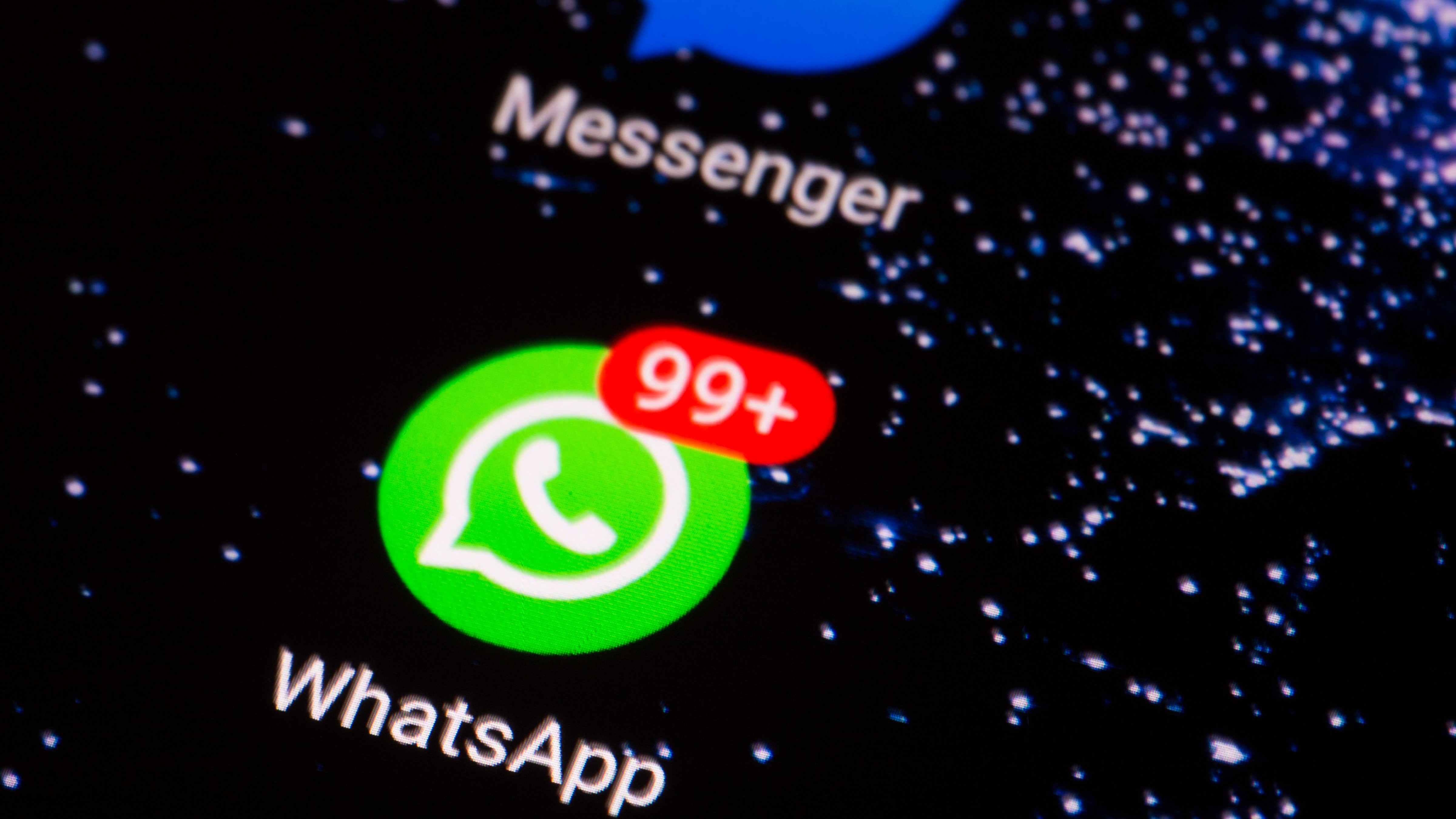 the WhatsApp logo on the smartphone screen close-up.