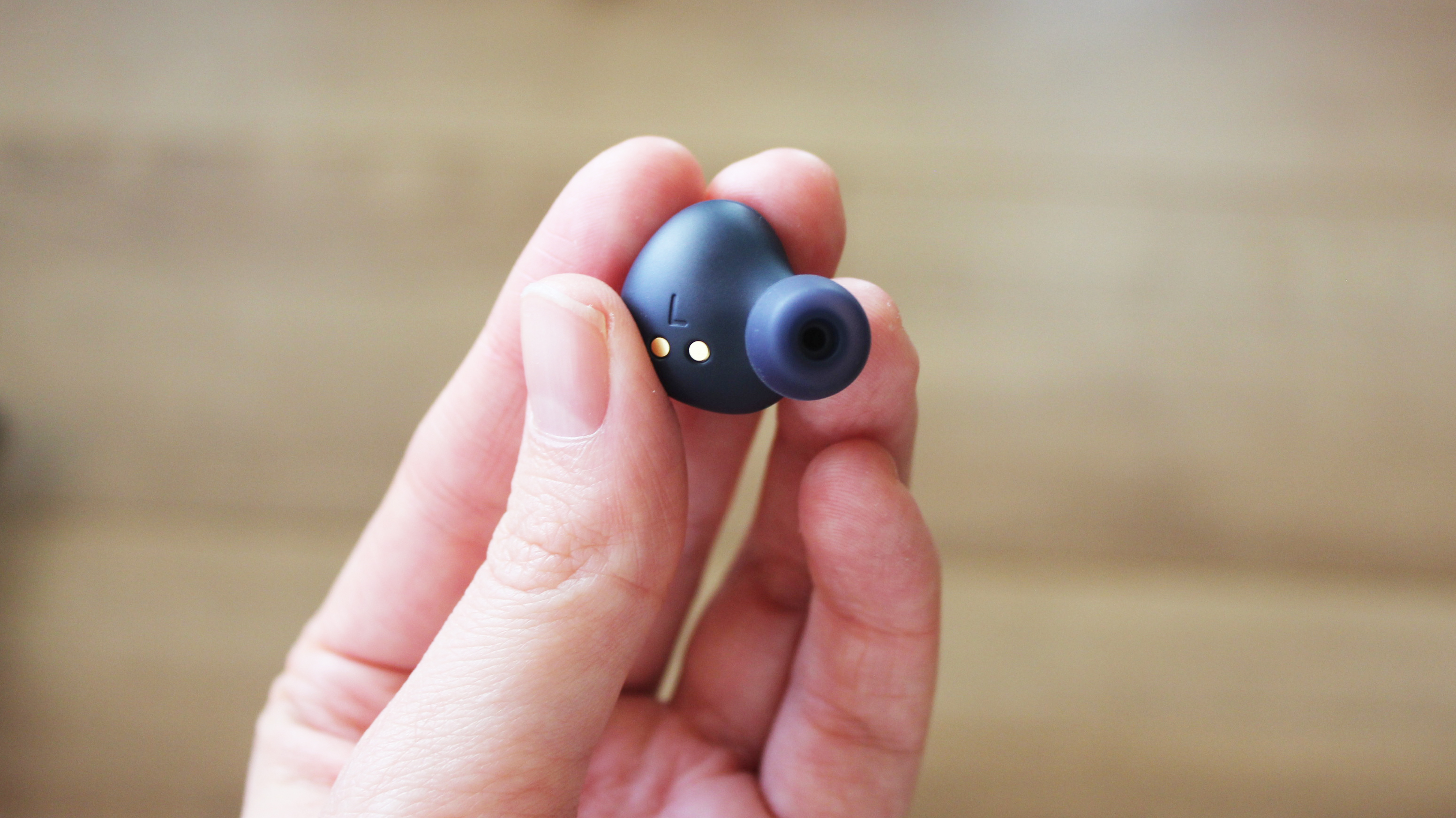 a close-up of the jabra elite 4 active earbud