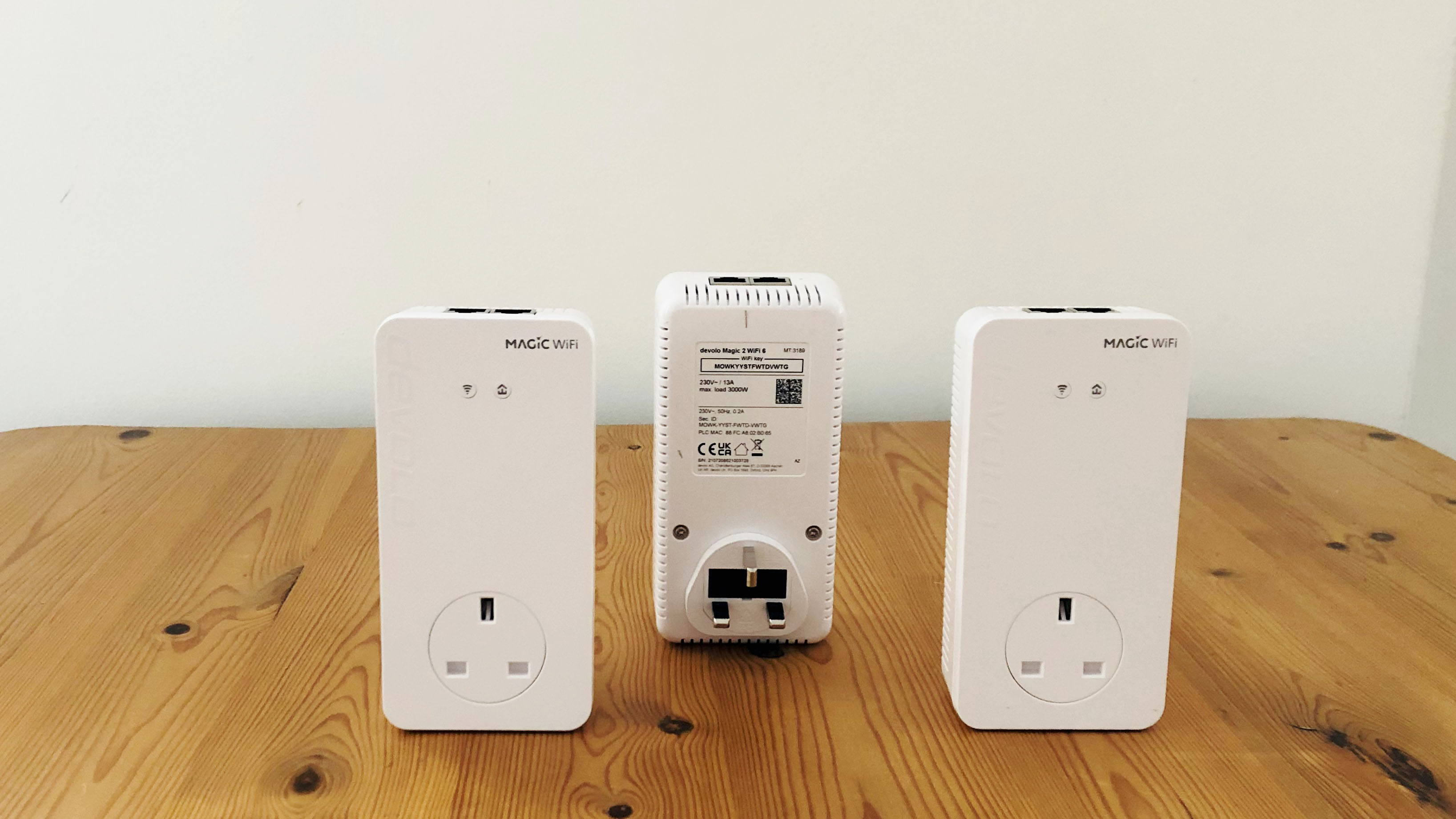 Devolo Magic 2 Wi-Fi 6 Mesh on a wooden desk
