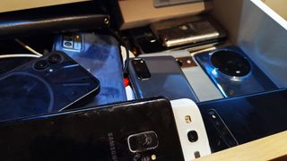 drawer full of old phones 