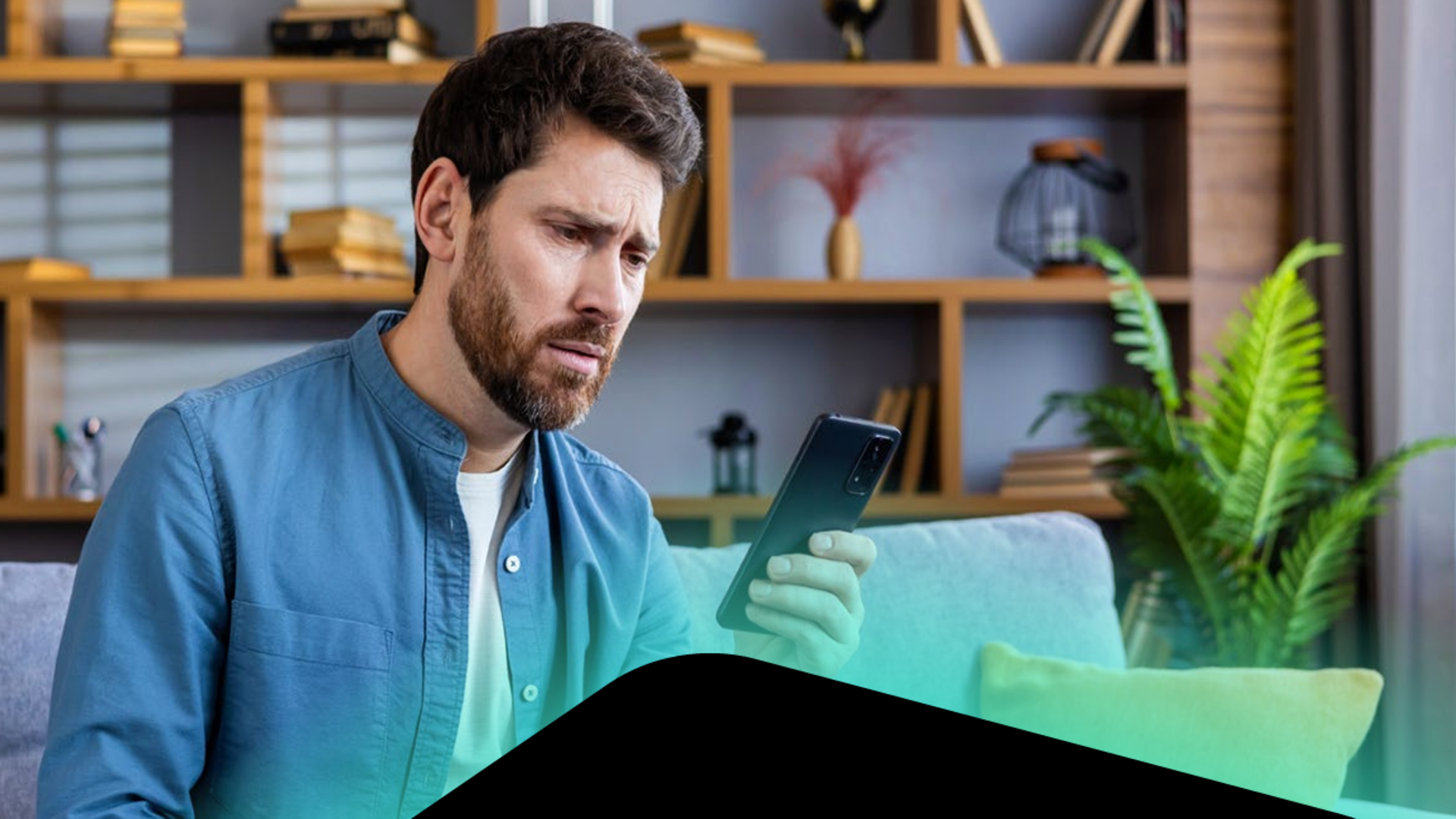 Man looking at phone after being scammed by an AI tool