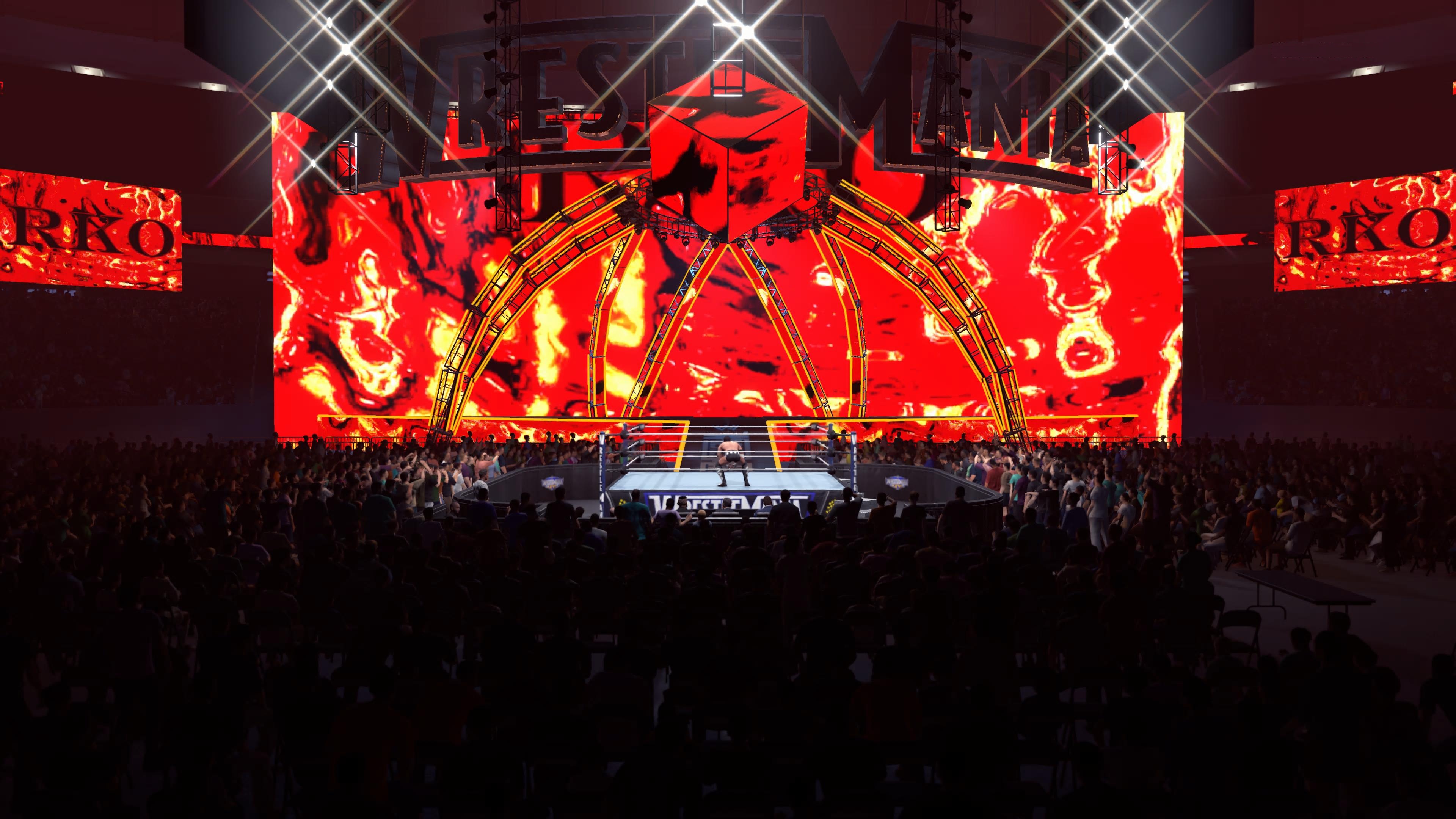 In-game screenshots from wrestling game WWE 2K26, showing wrestlers in the ring, making entrances, and the arena