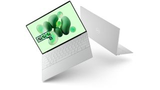 Two of the new Dell XPS 13 laptops in the Platinum colorway, shown back-to-back.