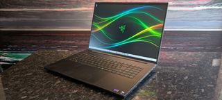 The Razer Blade 18 (2026) pictured on a black marble worktop.