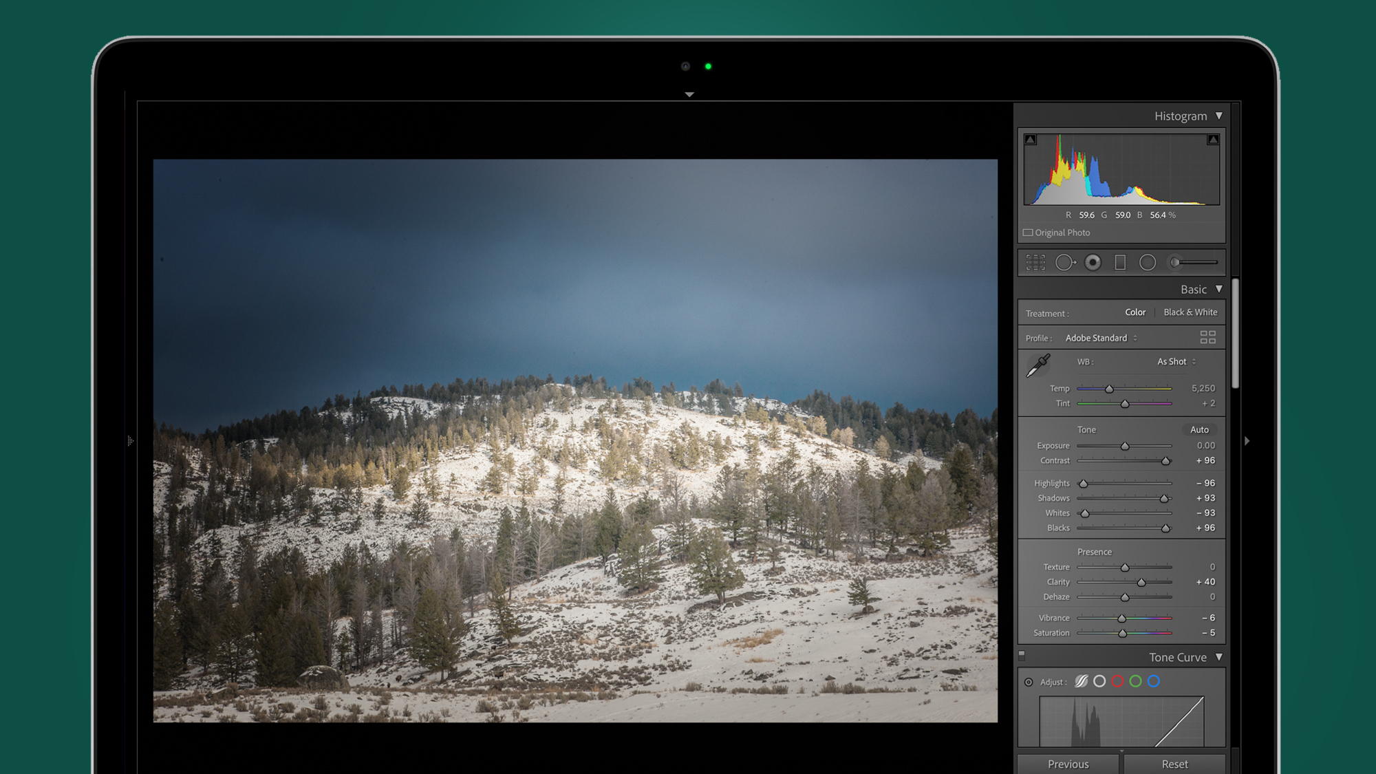 Snow-covered hills photo being edited with a Lightroom preset