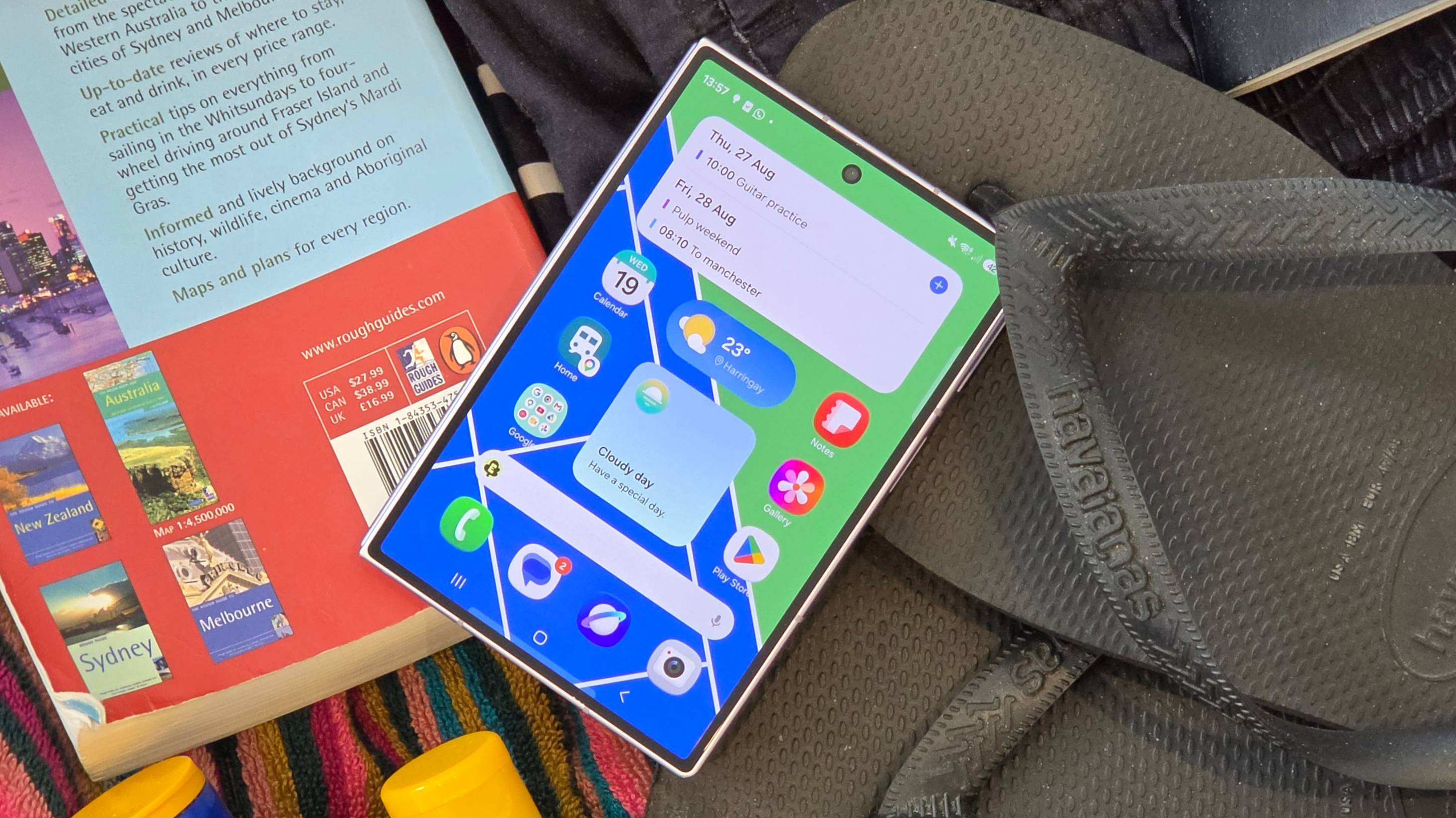 The Samsung Galaxy Z Fold 8 in a suitcase, on top of various items.