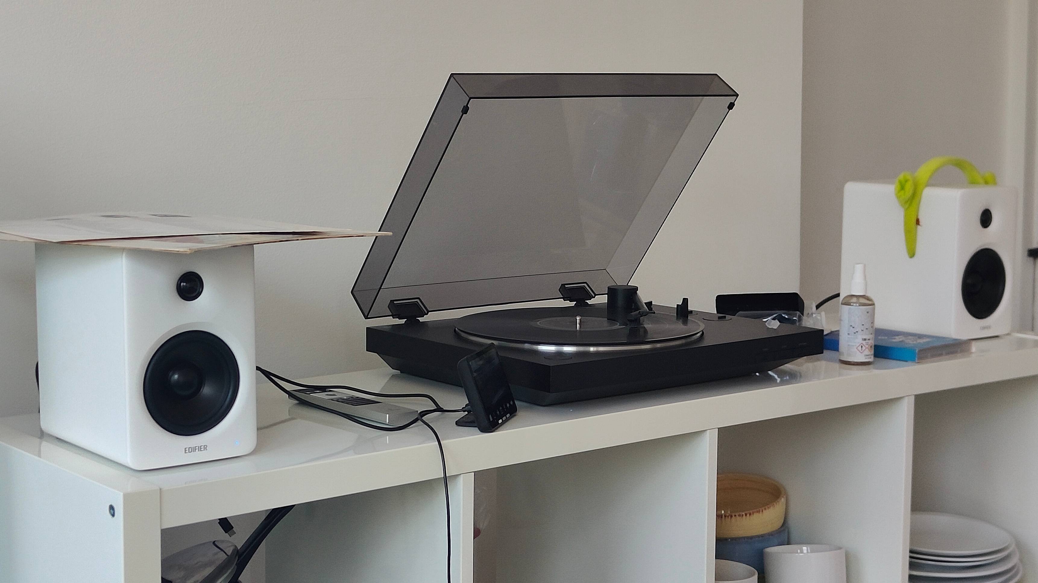 The Sony PS-LX310BT and Edifier M90 on a shelf.
