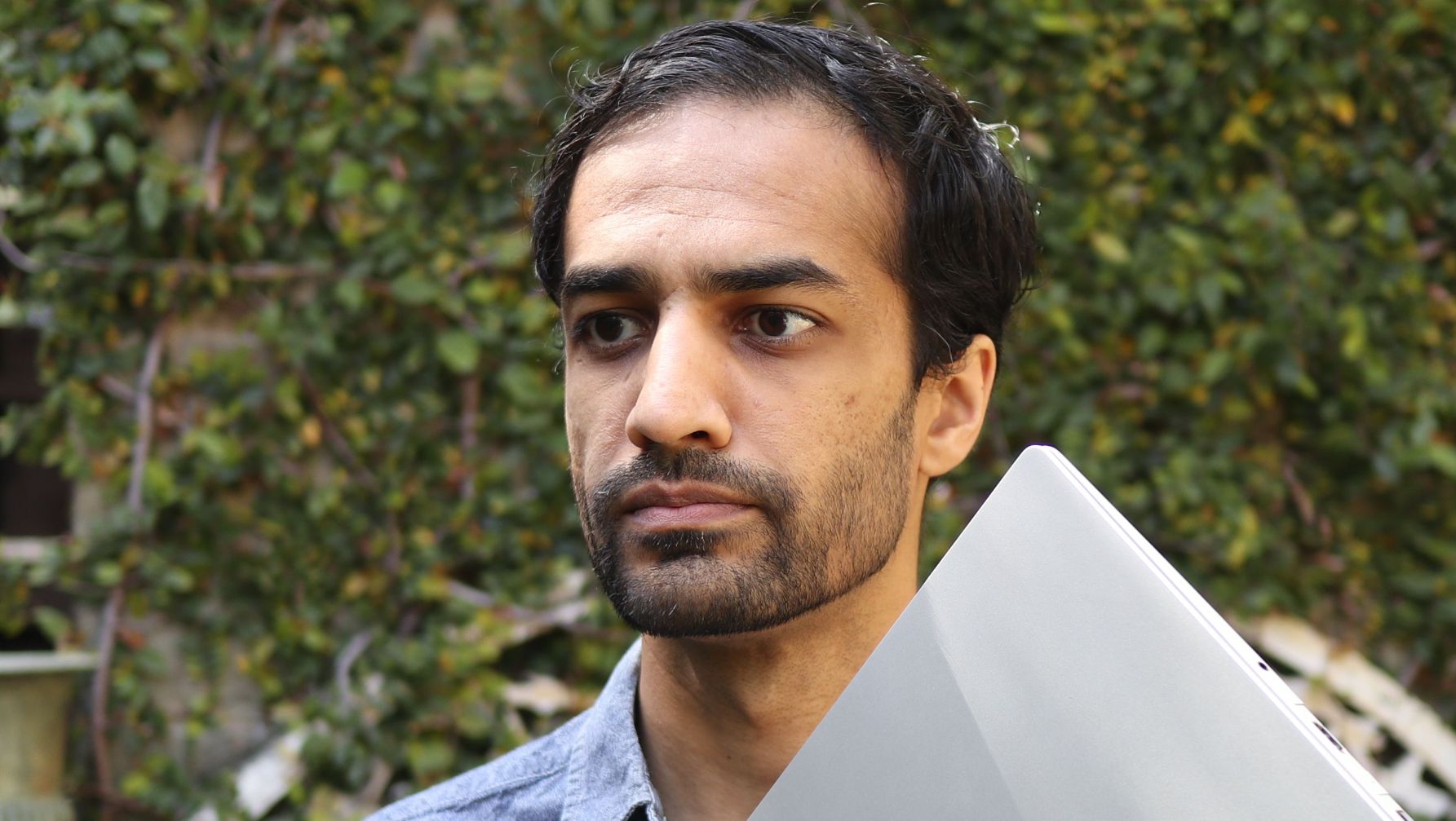 Nirav Patel holding a Framework laptop