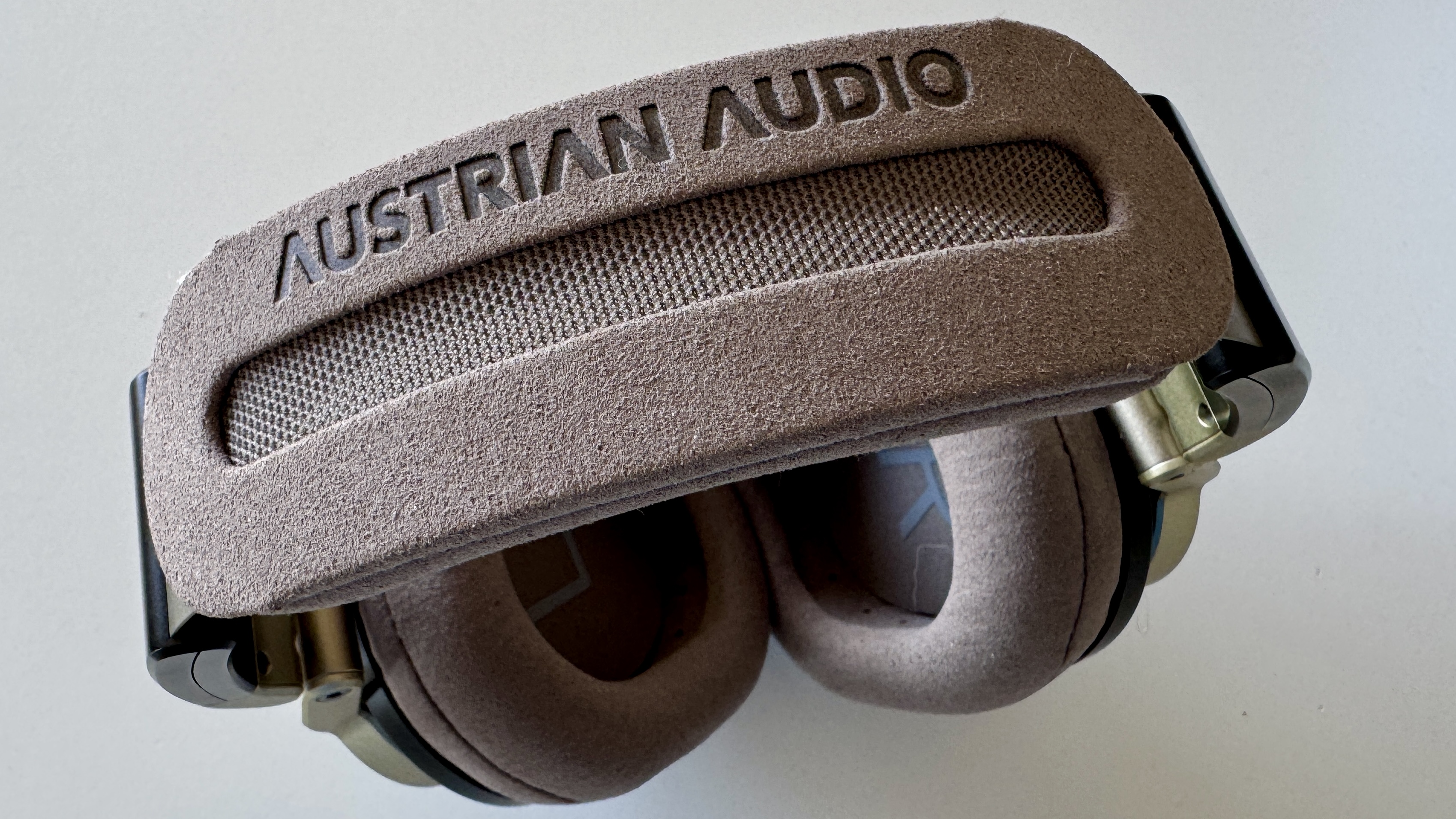 Top-down shot of the headband of the Austria Audio The Arranger open-backed headphones, on a white surface.