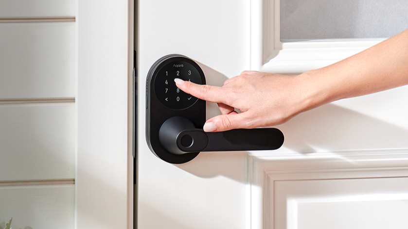 Woman's hand using Aqara Smart Lock U300