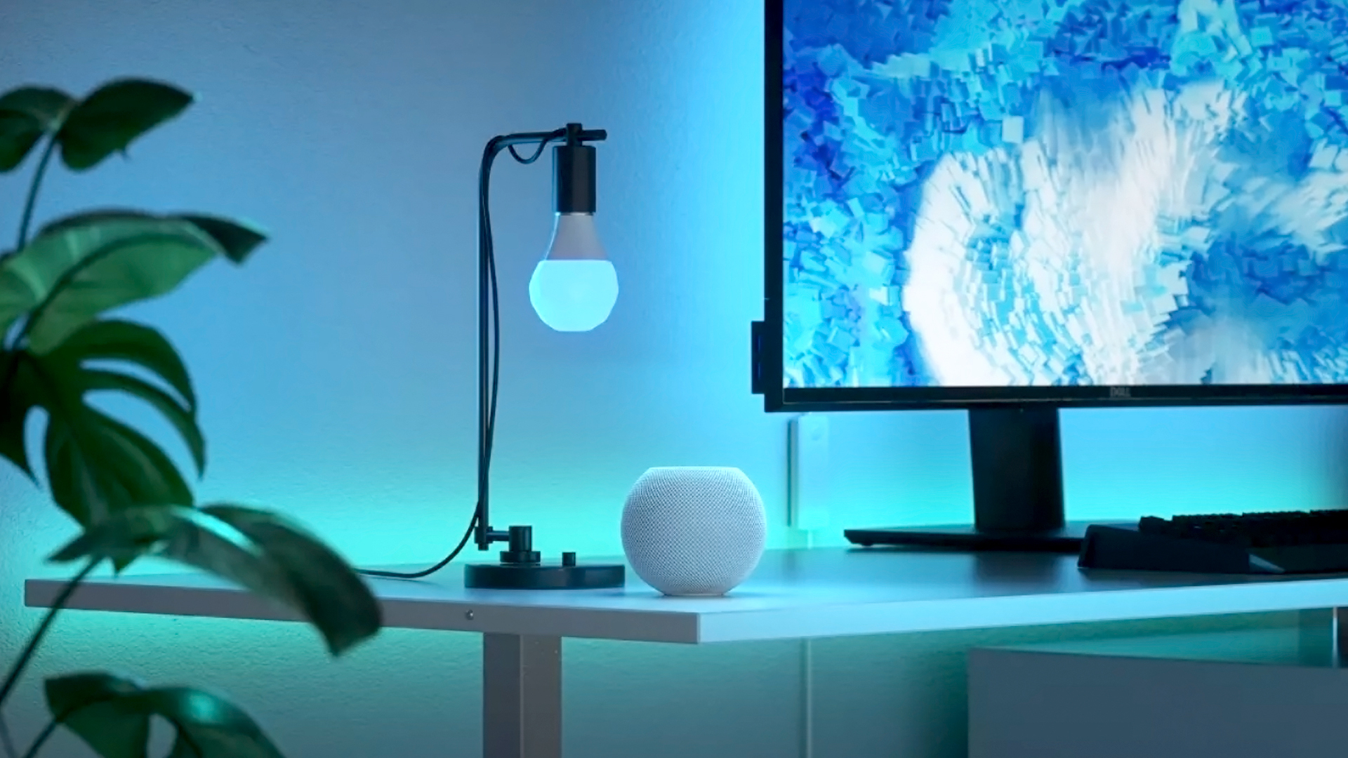 A Nanoleaf Essentials smart bulb emitting soft blue light.