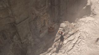 A sorcerer stands near the sacred statue