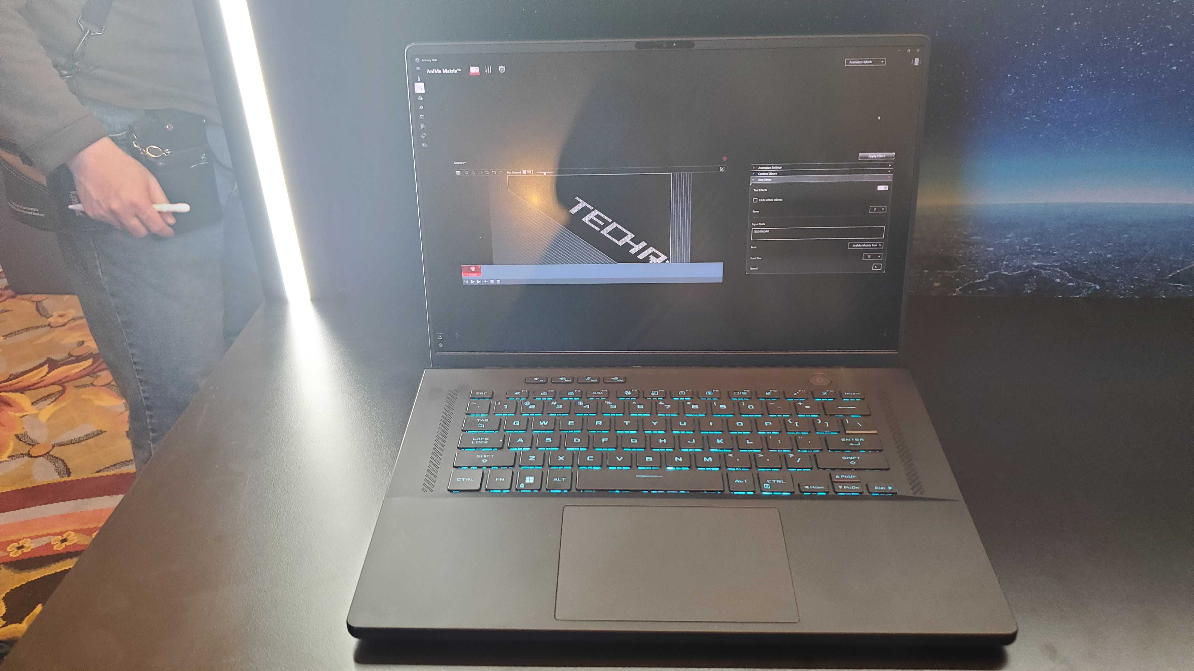 black gaming laptop with lit keyboard