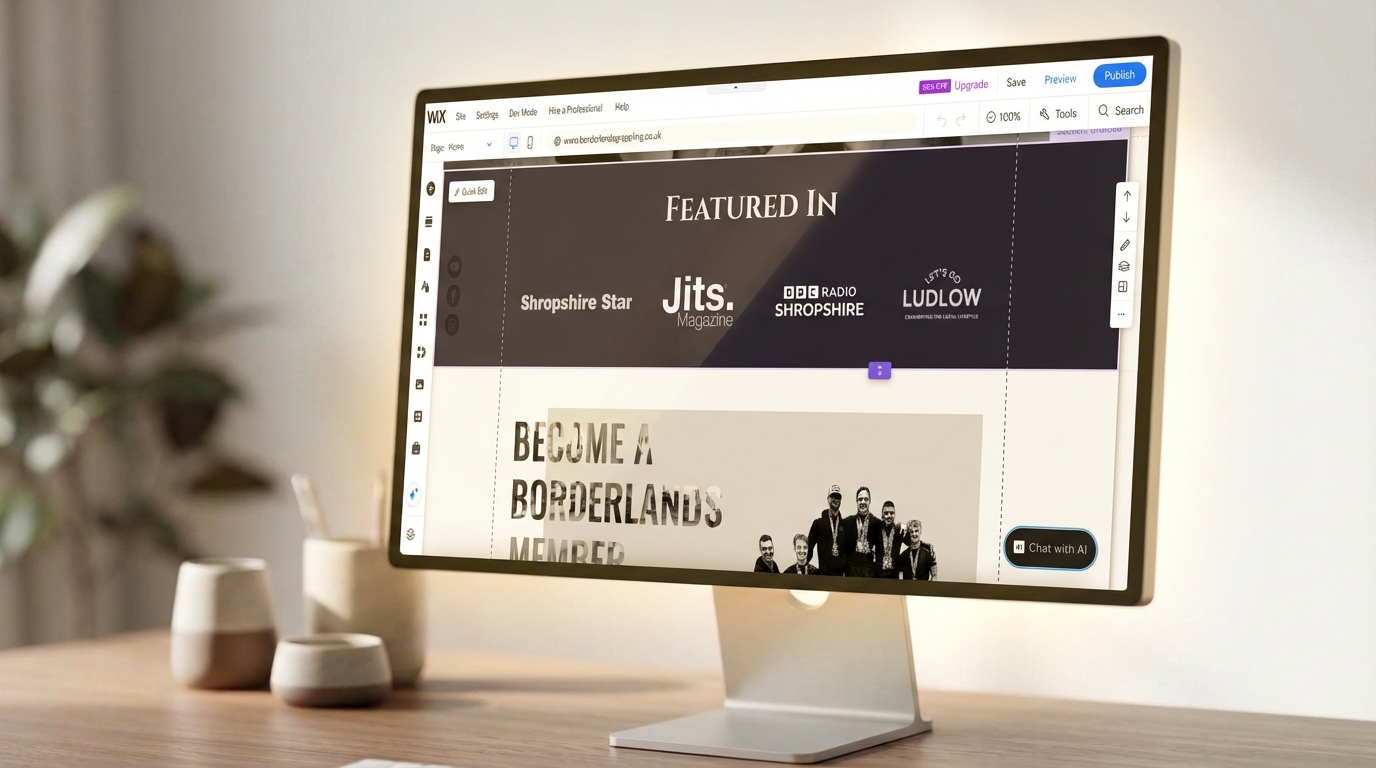 A screenshot of the Borderlands Grappling website built on Wix on a mac on top of a modern desk