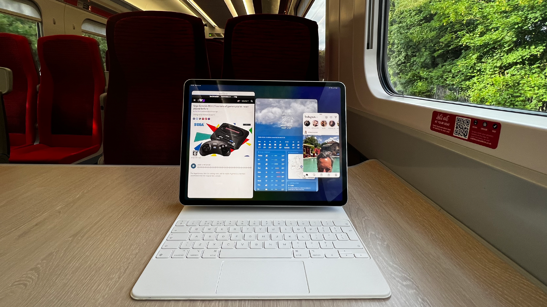 An iPad running iPadOS 16 on a train