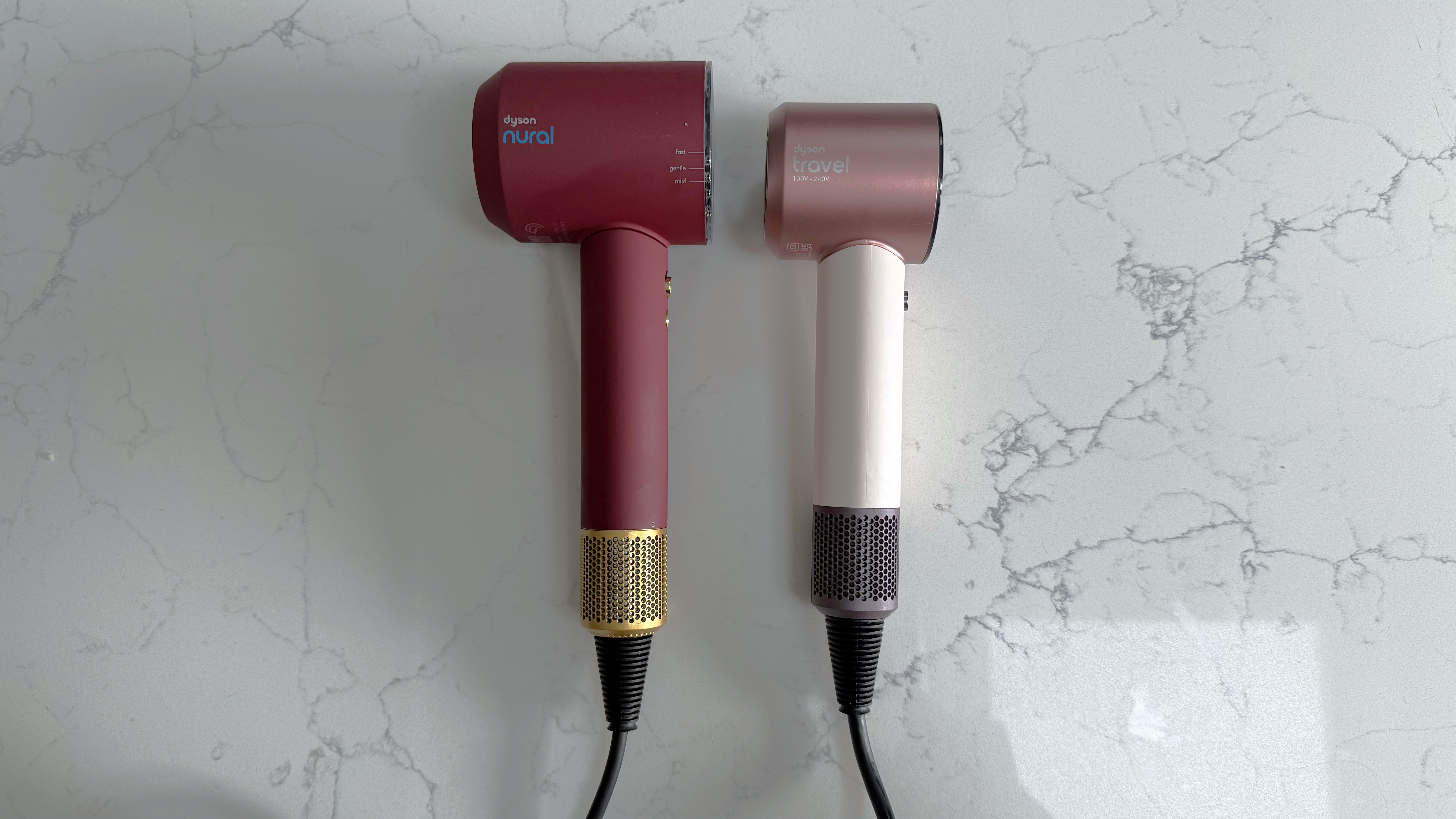 Dyson Supersonic Nural and Dyson Supersonic Travel hair dryers shown side by side