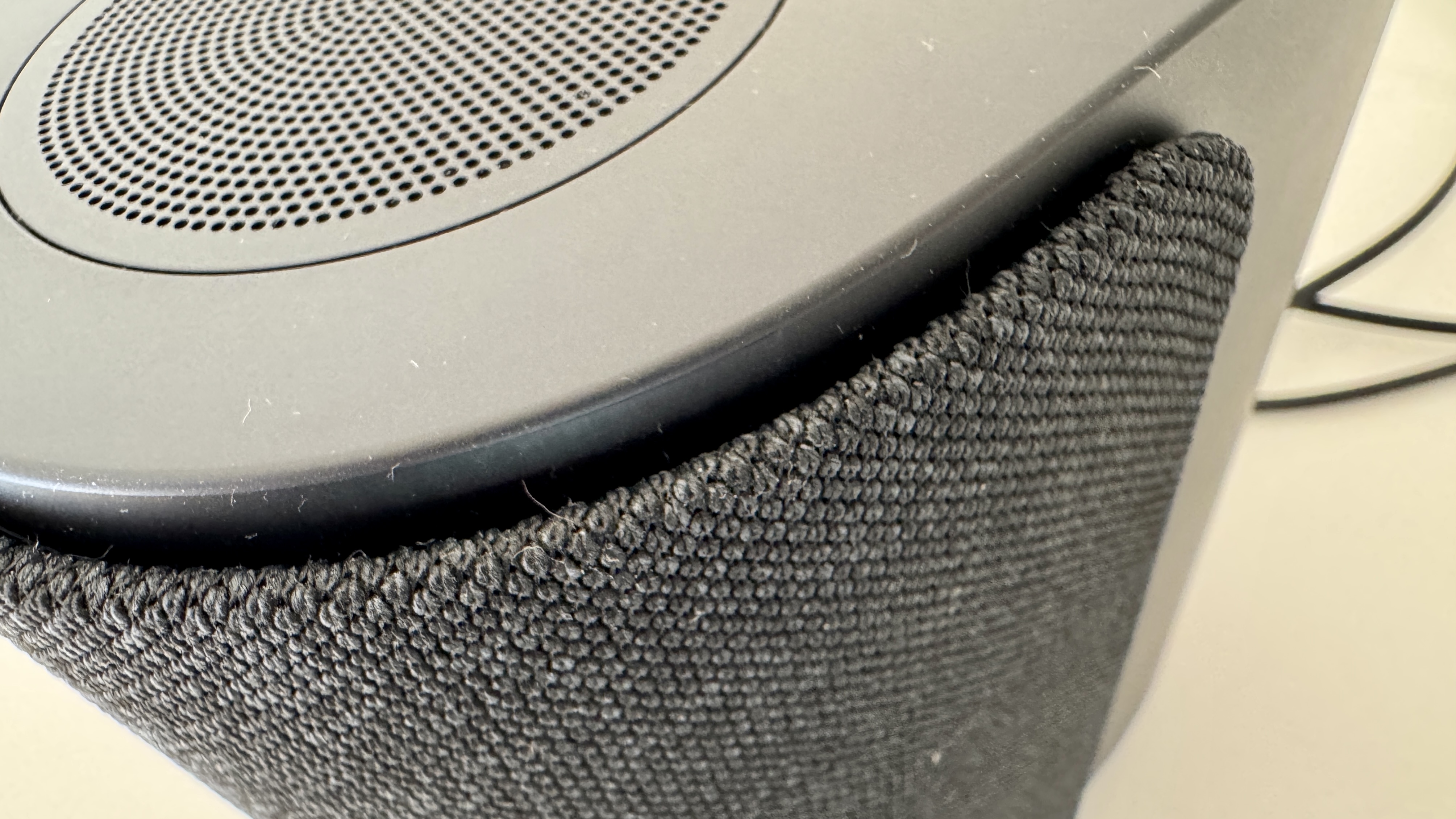 Bose Lifestyle Ultra speaker on a white table 