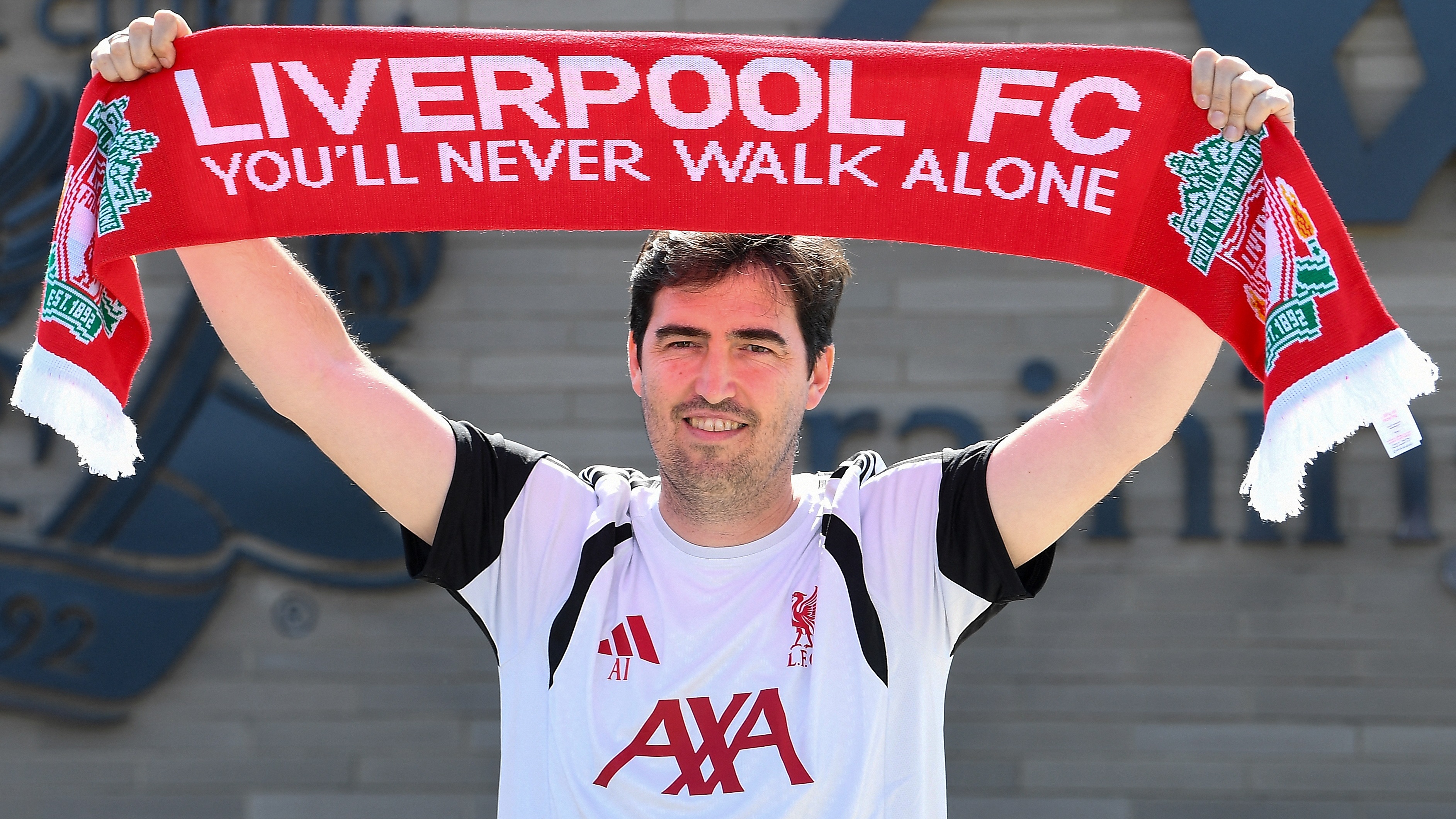 Andoni Iraola, the new manager for English Premier League football side Liverpool, poses as he meets the media at the team's training ground in Kirkby, Liverpool, north-west England on July 13, 2026