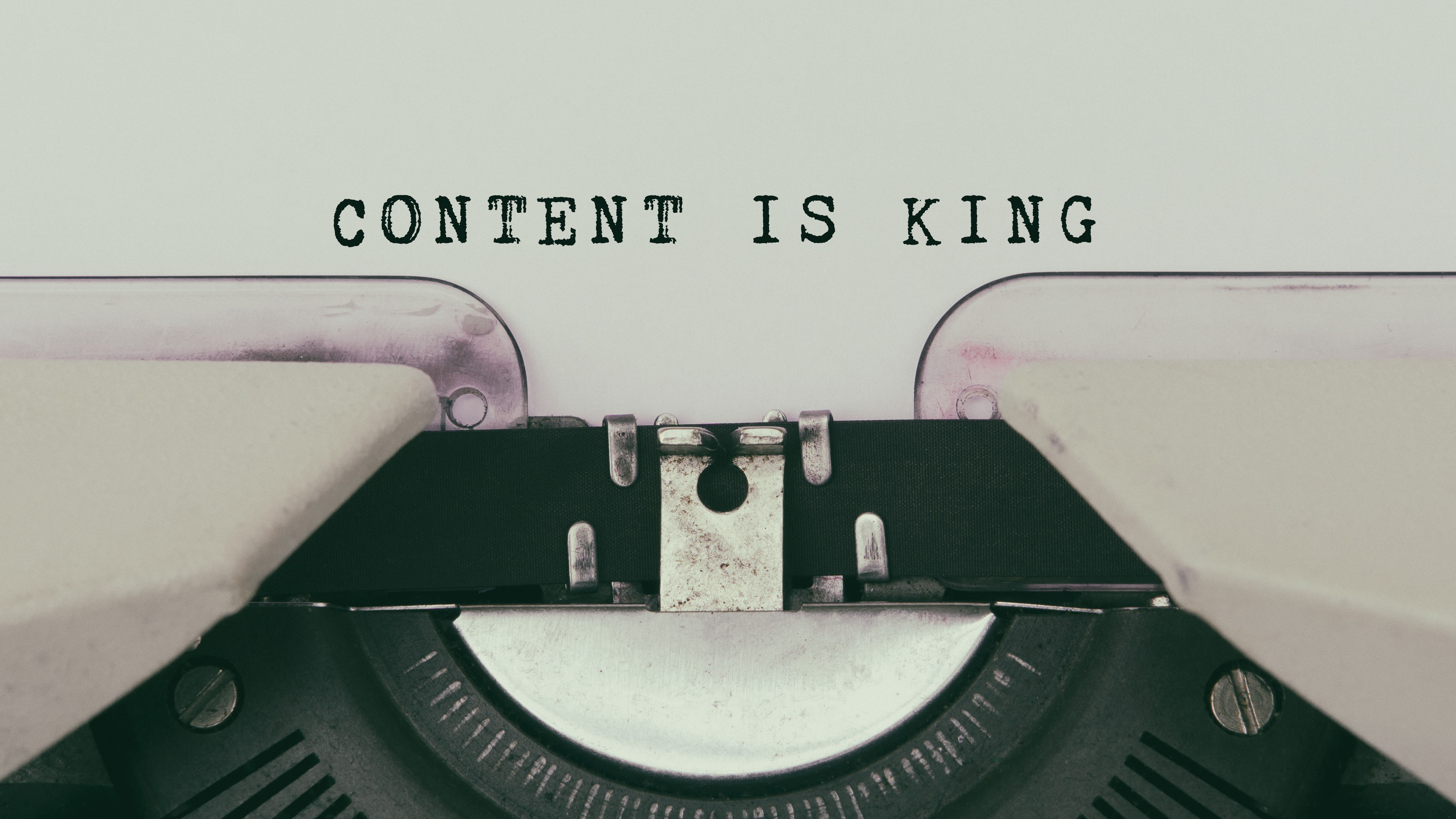 Typewriter with words: Content Is King typed out
