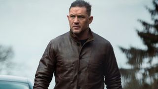 Tom Hardy looks at something in the distance