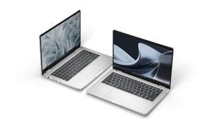 Two Dell laptops open, positioned next to each other at an angle