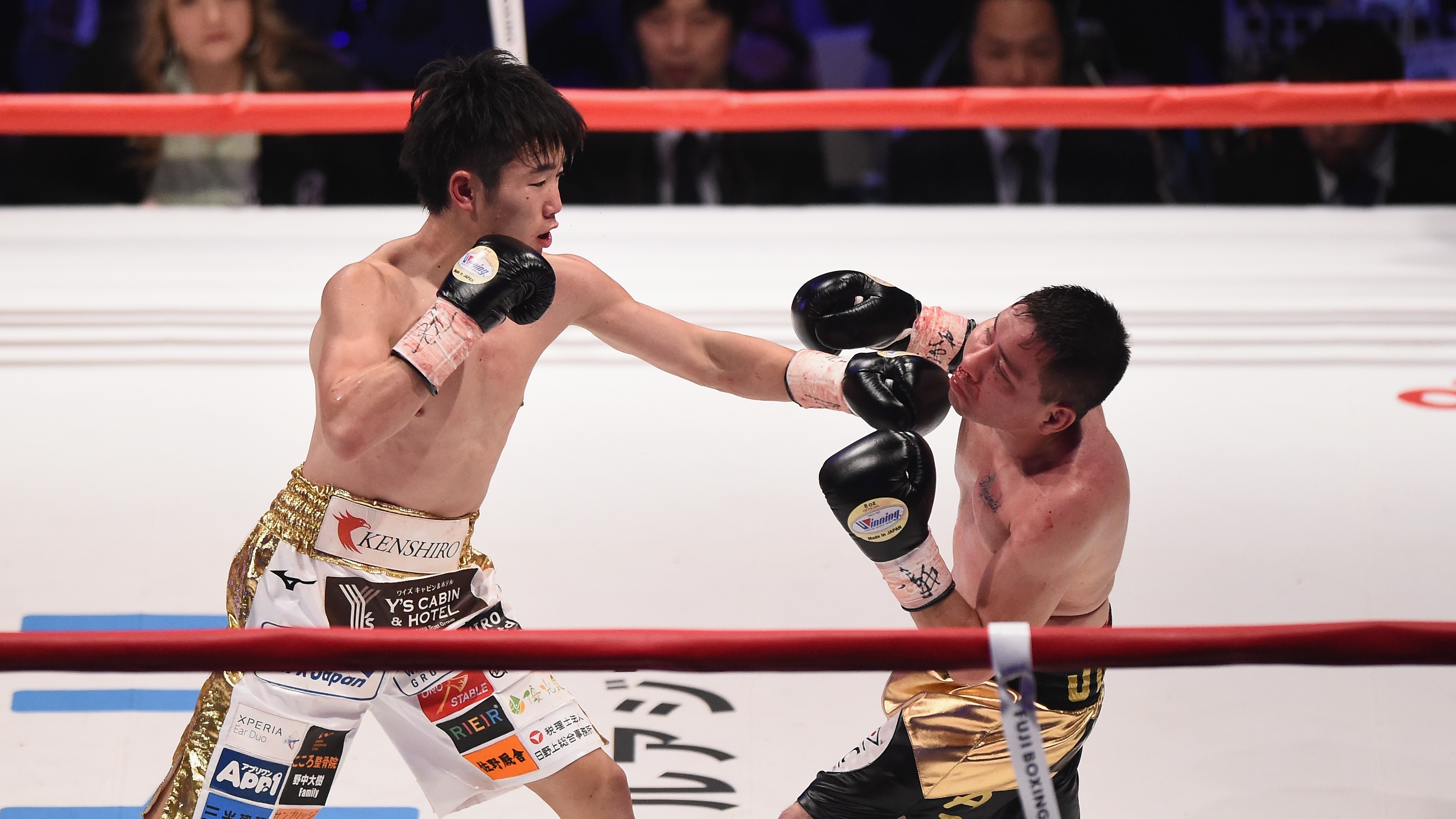 Kenshiro Teraji (L) of Japan competes against against Saul Juarez of Mexico during the WBC Light Flyweight Title