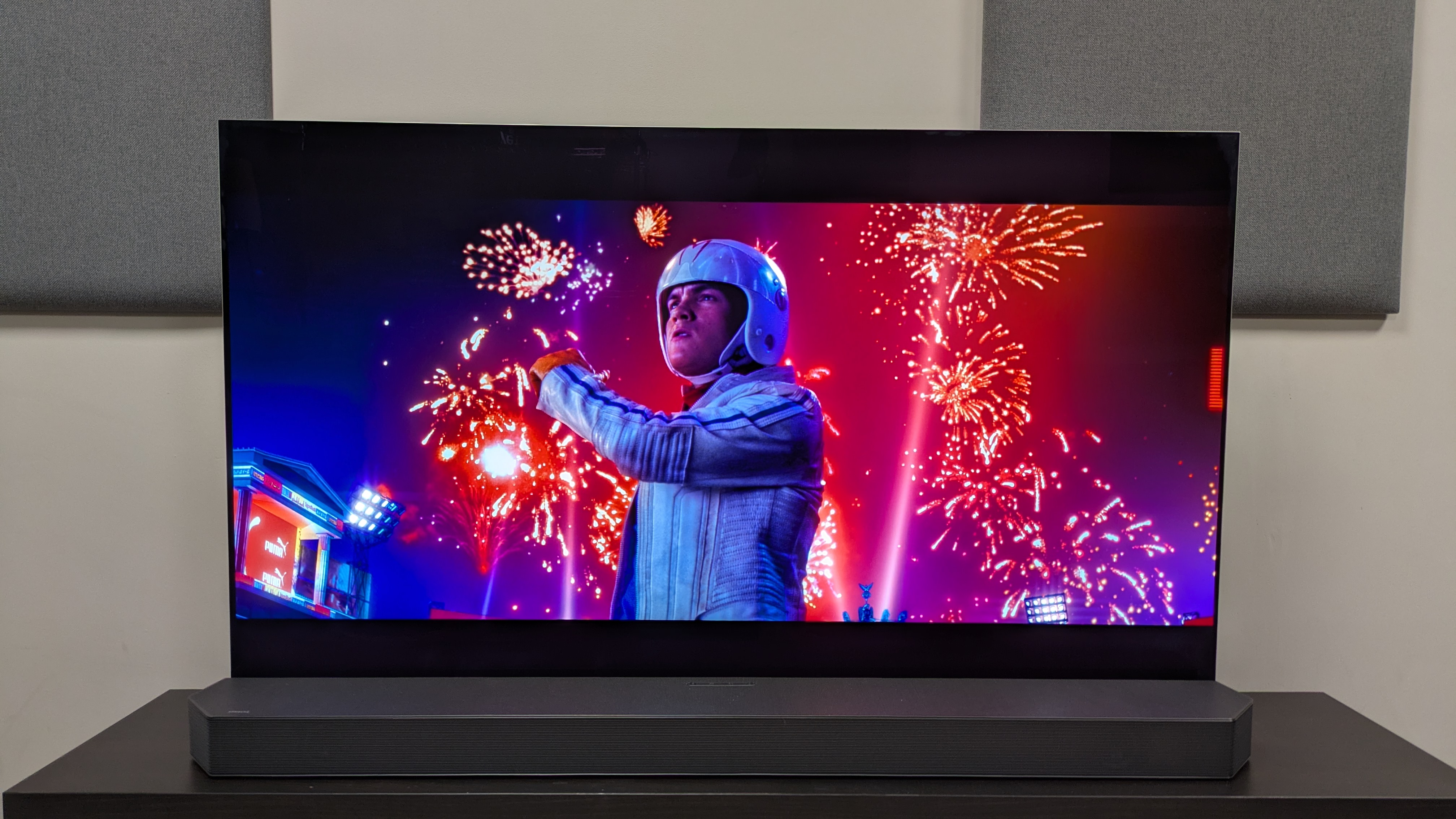 Speed Racer 4K Blu-ray on LG G5 showing Speed Racer stood in front of some bright fireworks 